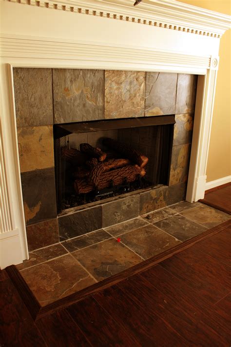 peel and stick fireplace tiles|replacing tile around fireplace.